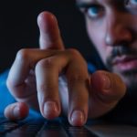 Frustrated person staring at how-to-get-your-amazon-seller-account-reinstated suspended Amazon Seller Account.